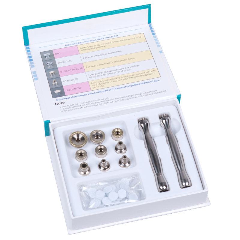 Beauty System 4-in-1 Diamond Microdermabrasion Machine BN-904 showing device with multiple attachments for skin exfoliation and rejuvenation.