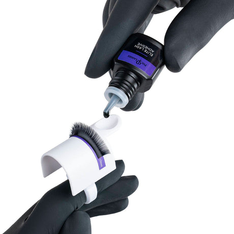 PhiLashes Elite Lash Adhesive — adhesive being dispensed into a ring cup