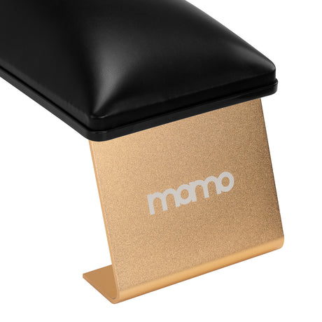 Black manicure support station from MOMO, a professional salon furniture piece with a sleek design for nail treatments.