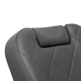 Close-up of decorative stitching on graphite barber chair upholstery