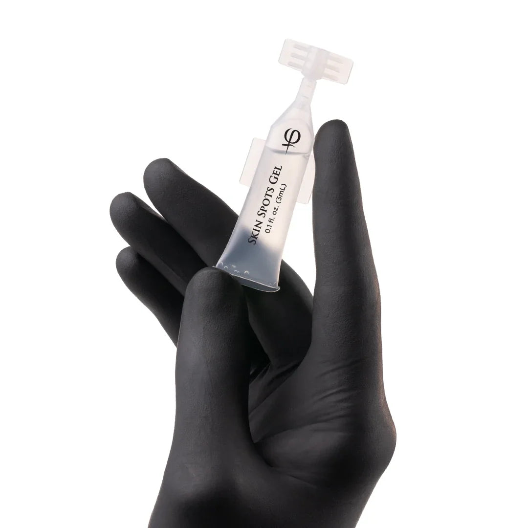 PhiAcademy Skin Spots Gel 3ml 5pcs — individual Skin Spots Gel ampoule held in a gloved hand